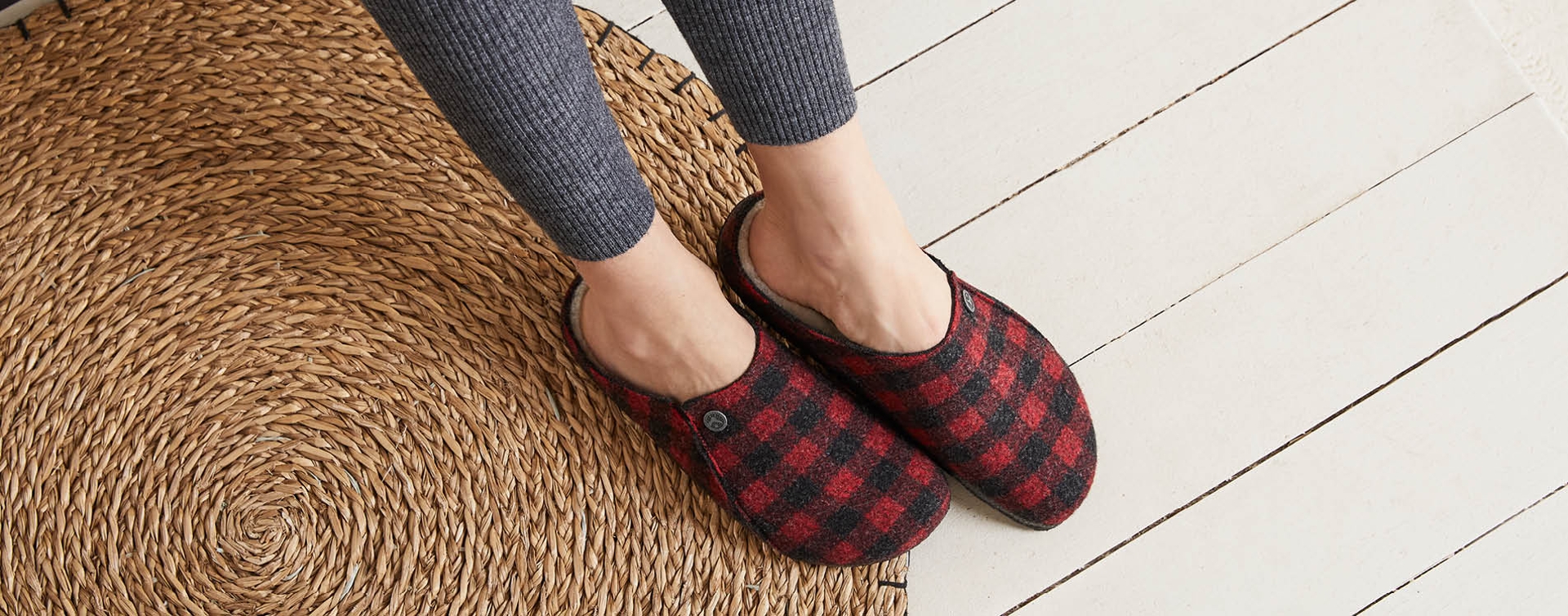 Close up of girl wearing plaid red slippers