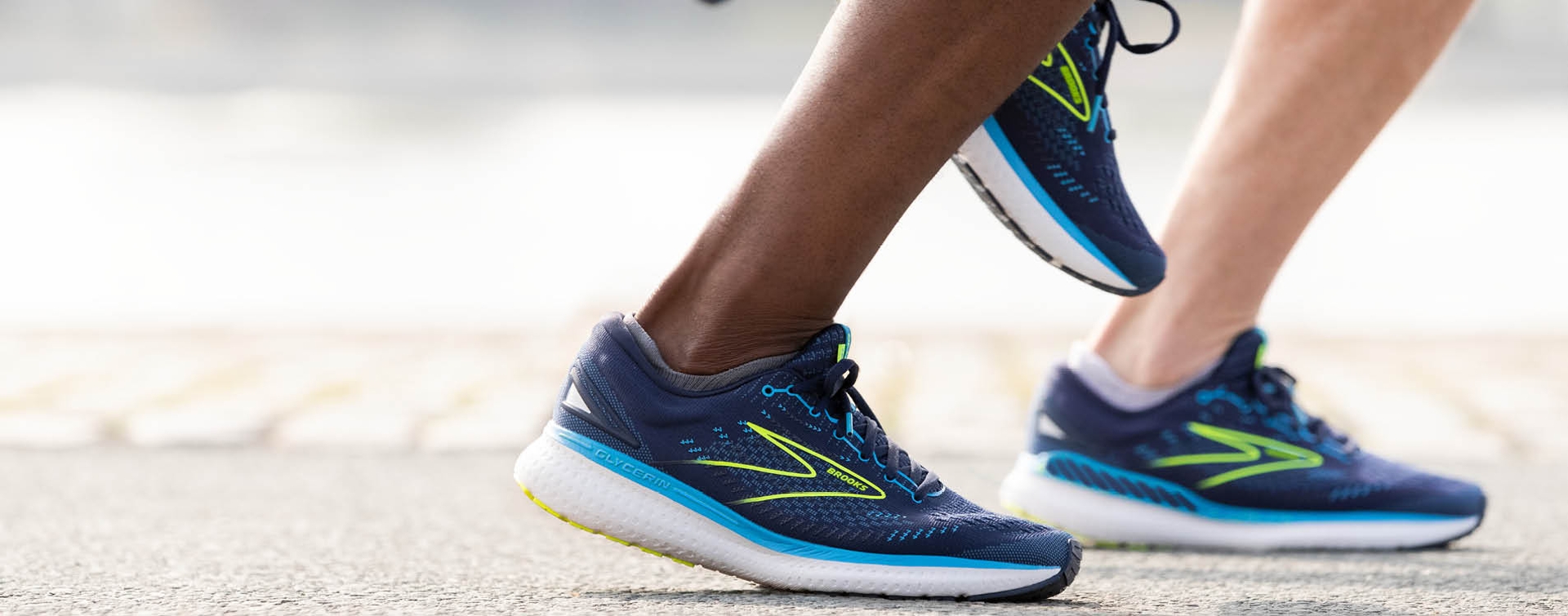 Close up of feet wearing Navy blue running sneaker