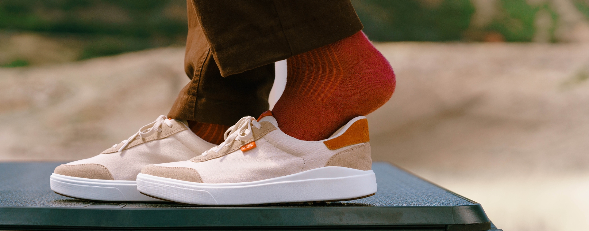 guy stepping into sneakers 